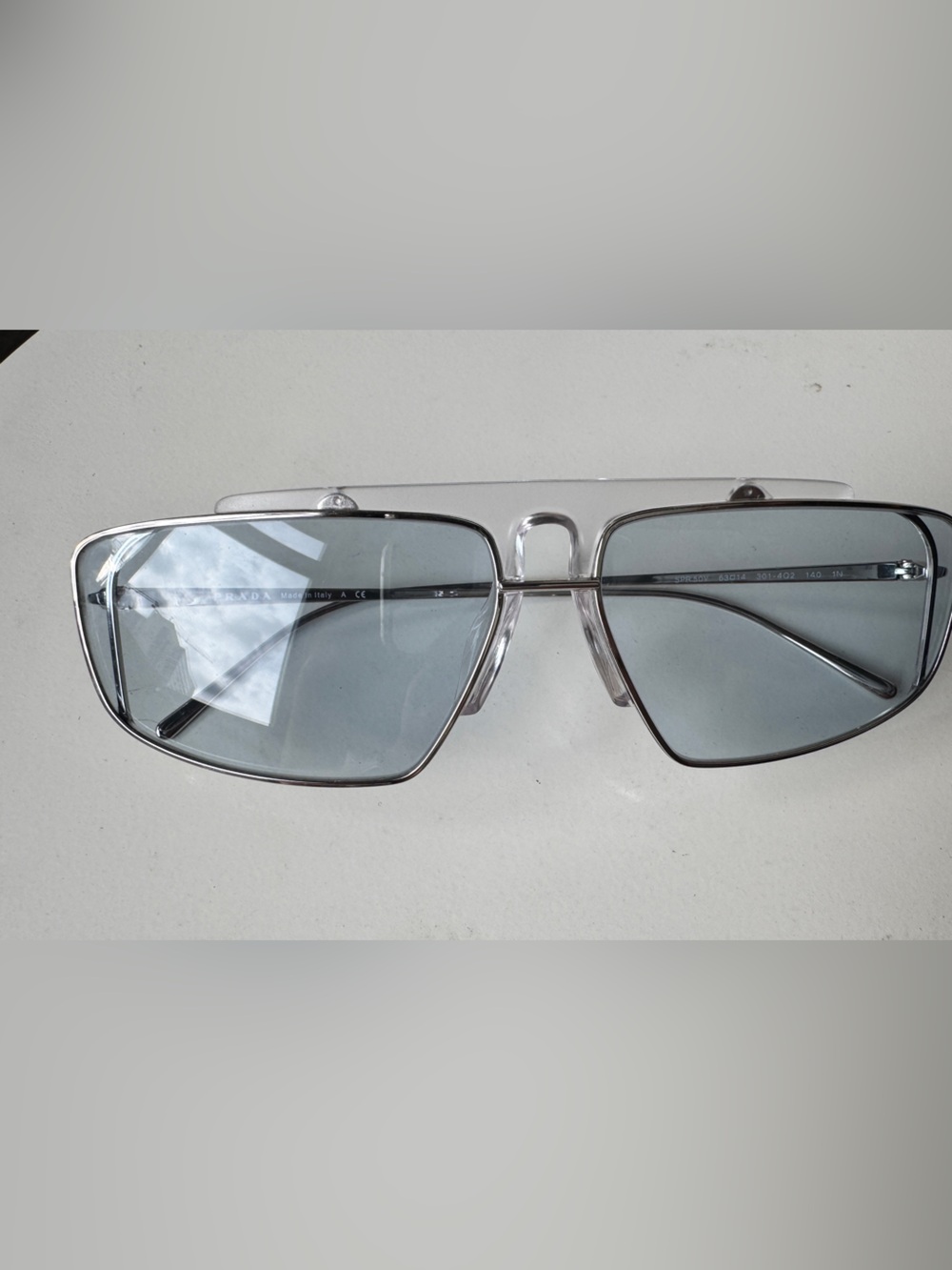 Prada Silver Frame Sunglasses with Light Blue Lenses unisex - Picture 2 of 13